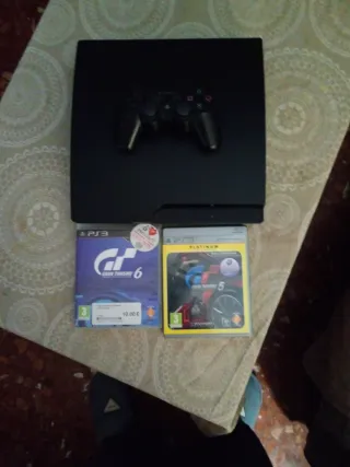 Consola PS3 con mando y juegos