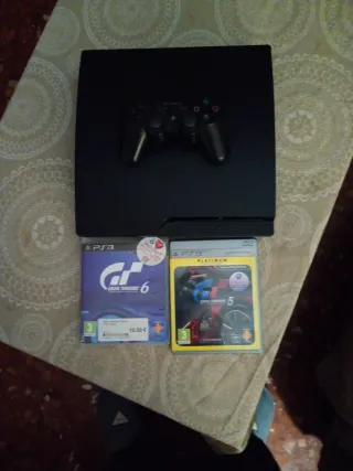 Consola PS3 con mando y juegos