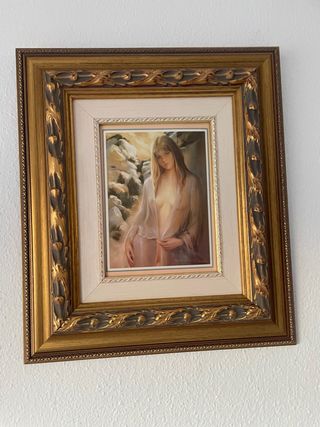 Cornice in legno e metallo dorato