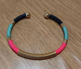 Pulsera brazalete Bimba y Lola dorada y multicolor