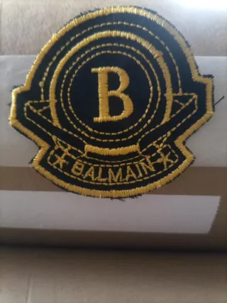 Toppa Balmain nera e oro