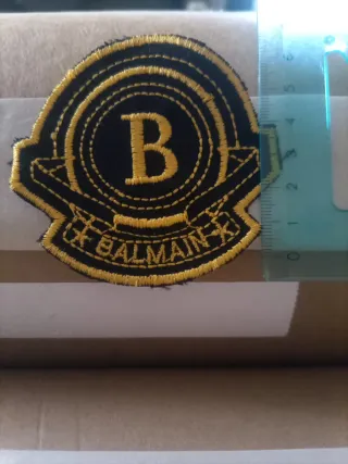 Toppa Balmain nera e oro