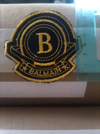 Toppa Balmain nera e oro