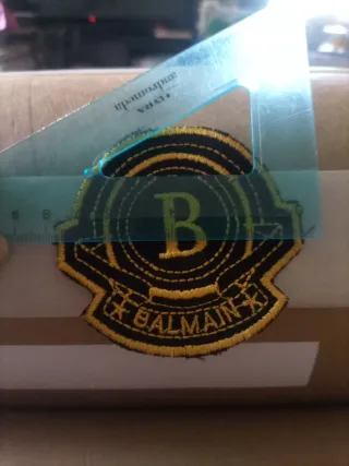 Toppa Balmain nera e oro