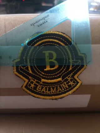 Toppa Balmain nera e oro