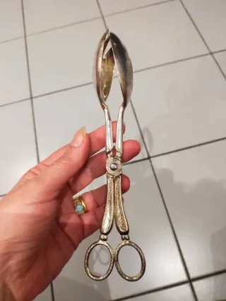 Pinza da portata in metallo argentato