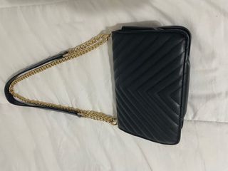 Bolso de hombro Saint Laurent negro y dorado