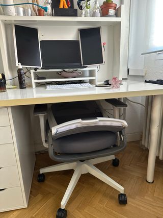 Silla ergonómica con reposapiés y reposa cabeza