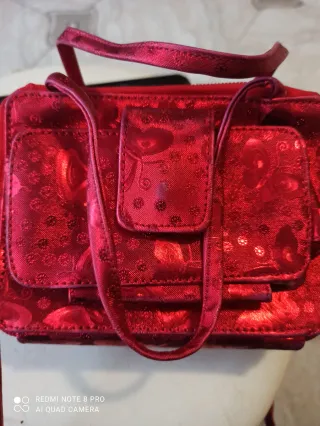 Borsa rossa con fantasia floreale con porta foglio