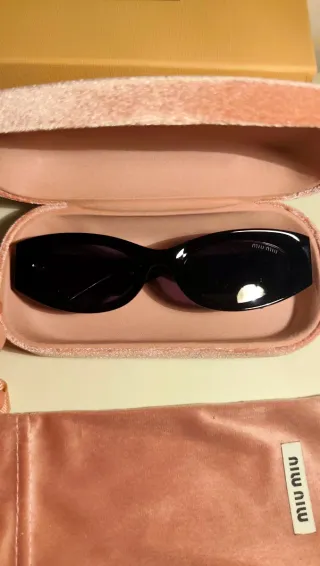 Occhiali da sole Miu Miu neri e oro