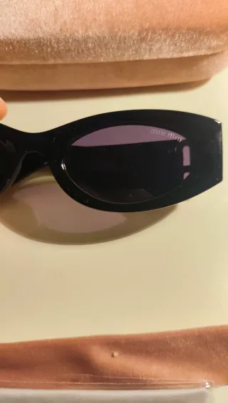 Occhiali da sole Miu Miu neri e oro