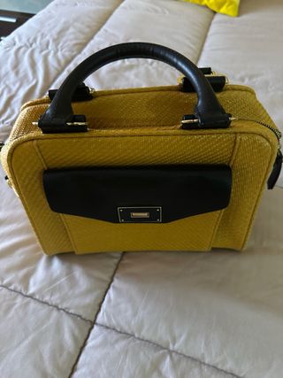 Bolso de mano amarillo y negro