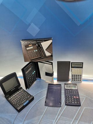 4 calculadoras, CASIO FC-100, SILVANO SL-570TL, calculadora solar, notebook