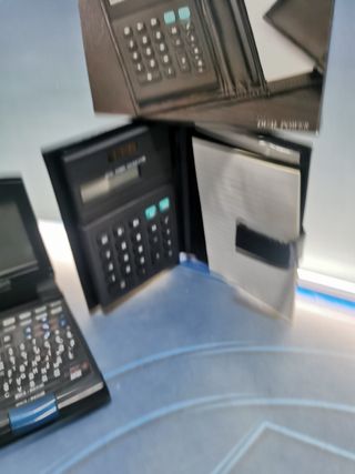 4 calculadoras, CASIO FC-100, SILVANO SL-570TL, calculadora solar, notebook