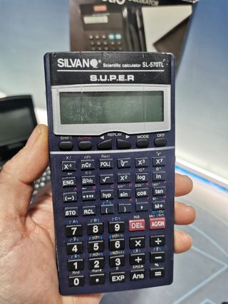 4 calculadoras, CASIO FC-100, SILVANO SL-570TL, calculadora solar, notebook