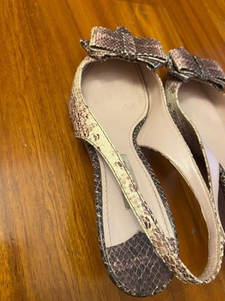 Décolleté Miu Miu con fiocco pitone