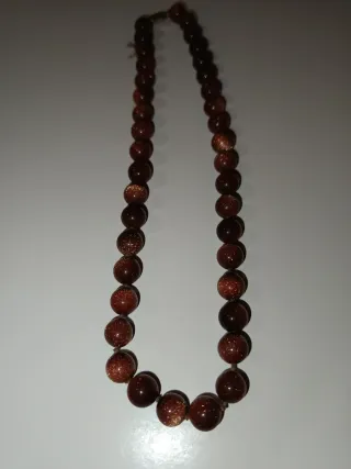 Collana con perle marroni e dorate