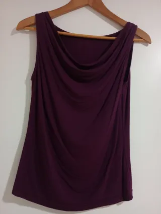 1,50€Camiseta morada escote drapeado