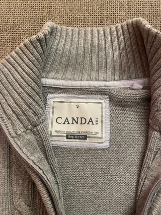 Jersey gris con cremallera y trenzado