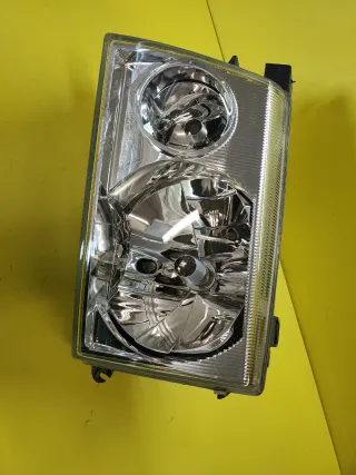 FARO DELANTERO IZQUIERDO NISSAN TERRANO II PLATA