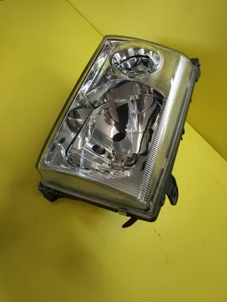 FARO DELANTERO IZQUIERDO NISSAN TERRANO II PLATA