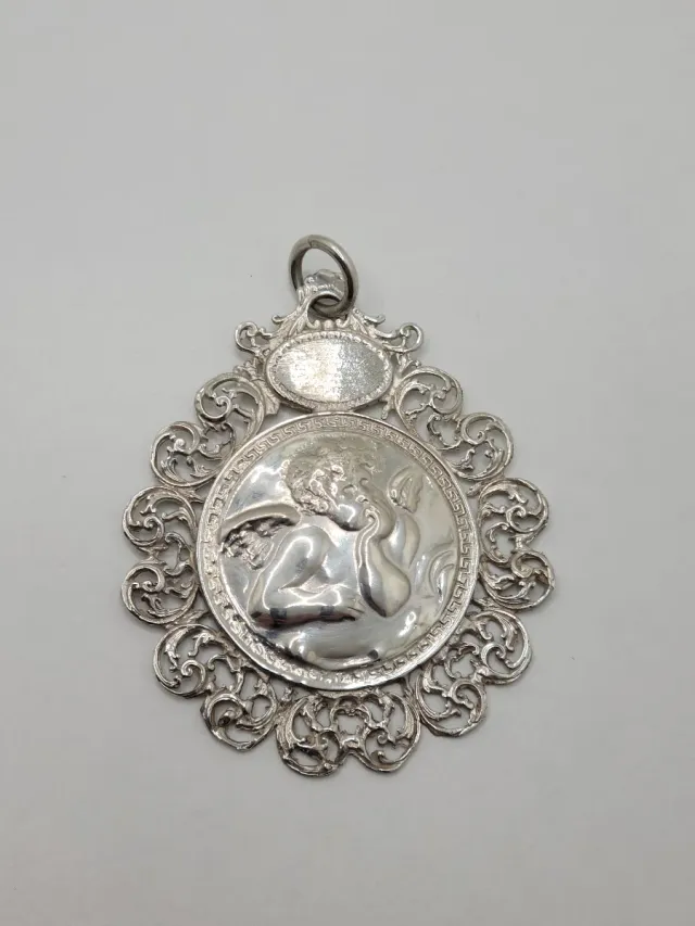 Medallón de Cuna antiguo de Plata