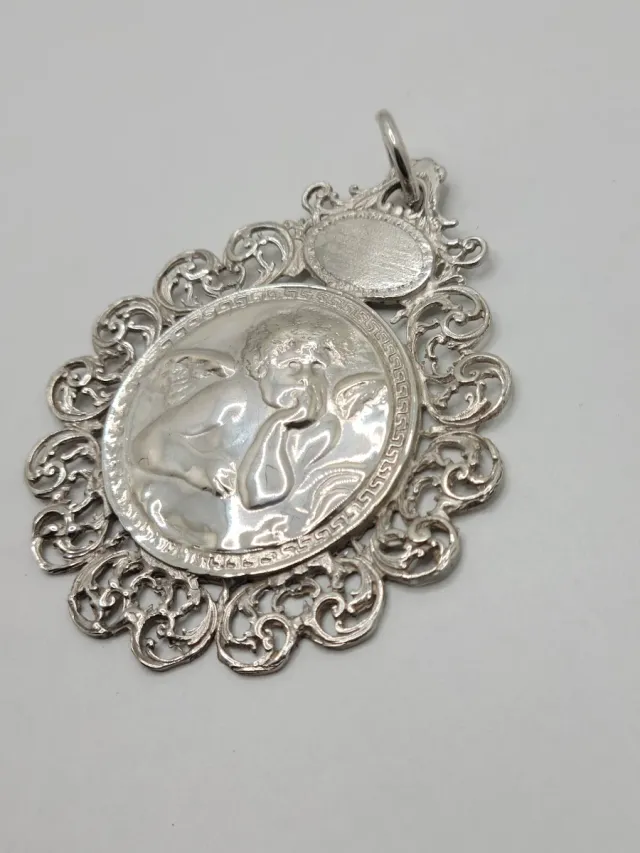 Medallón de Cuna antiguo de Plata