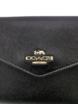 Bolso Clutch Coach Piel Negro