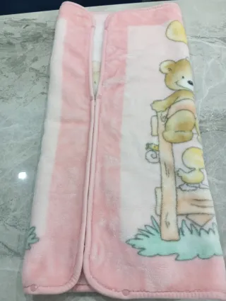 Coperte culla rosa e bianche