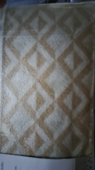 Piumone matrimoniale pile beige/marrone.