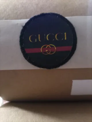 Toppa Gucci nera e oro