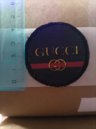 Toppa Gucci nera e oro