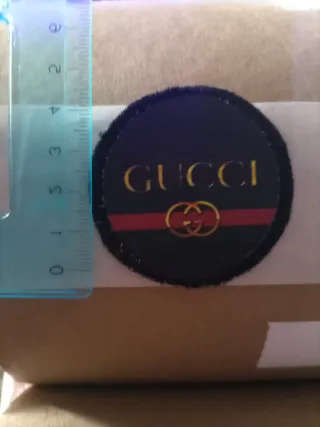 Toppa Gucci nera e oro