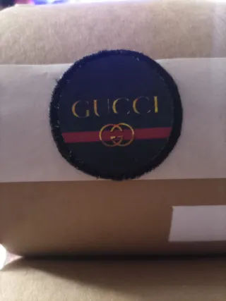Toppa Gucci nera e oro