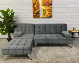 Sofá cama gris de terciopelo