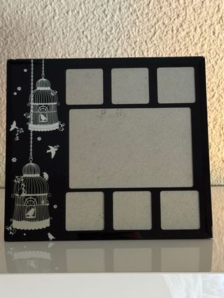 Marco foto con incisione di uccelli e gabbie