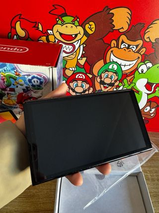 Nintendo Switch OLED 2024 COMO NUEVA + animal cros