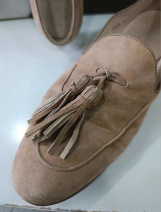 Mocasines de piel beige con flecos