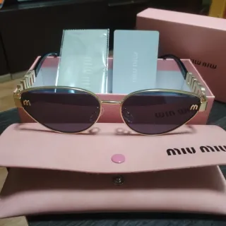 Gafas de sol Miu Miu doradas