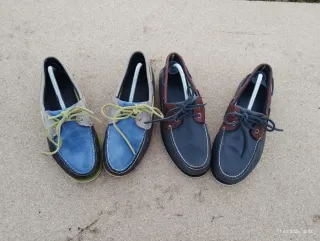 Scarpe uomo Timberland blu e marroni.