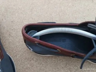 Scarpe uomo Timberland blu e marroni.