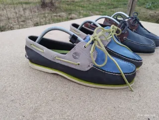 Scarpe uomo Timberland blu e marroni.