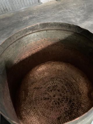 Pentola in rame con coperchio