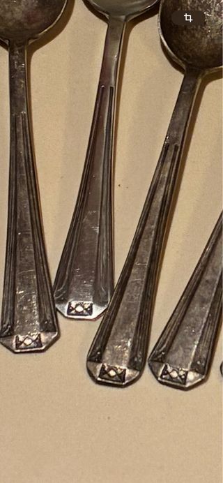 11 cucchiaini da dessert in metallo argentato