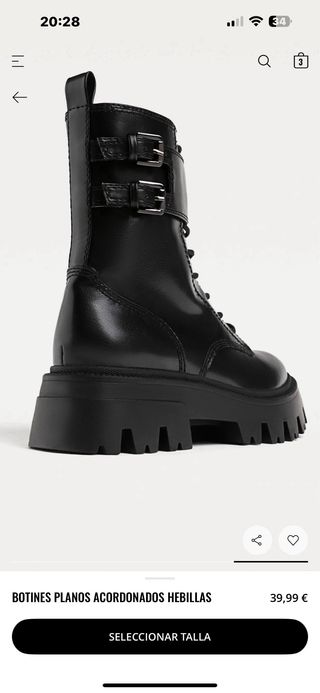 Botines planos acordonados con hebillas