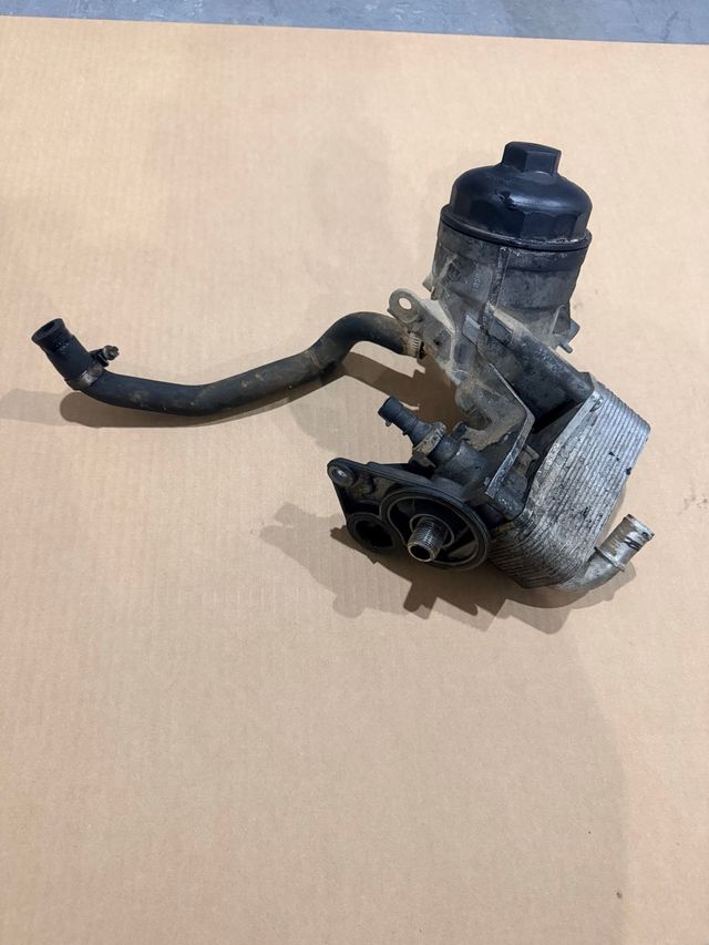 Portafiltro y radiador aceite