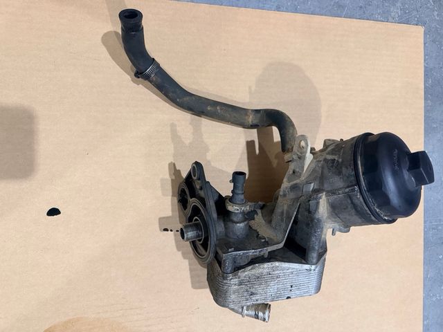 Portafiltro y radiador aceite