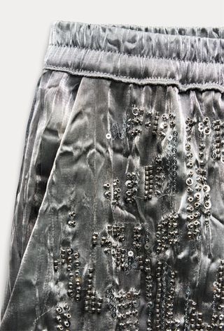 Pantalón plateado abalorios