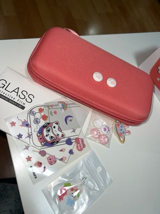 Nintendo Switch Lite Coral y juego animal crossing