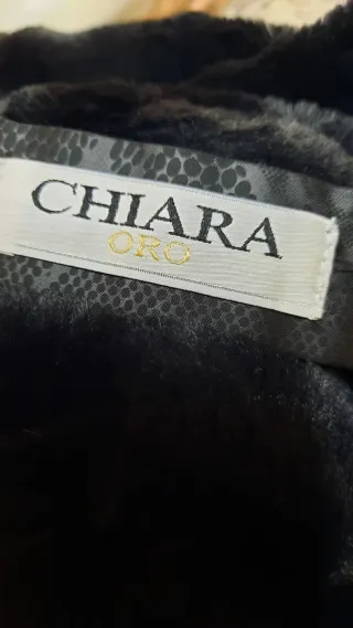 Elegante cappotto reversibile pelliccia e lucido